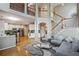 Open floor plan features a living room that connects to a well-appointed kitchen and a staircase at 2325 Walnut Grove Way, Suwanee, GA 30024