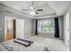Large main bedroom with great natural light, neutral decor, and carpeted floors at 2325 Walnut Grove Way, Suwanee, GA 30024