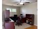 Comfortable office with large desk, ceiling fan, carpeting and plenty of natural light at 2325 Walnut Grove Way, Suwanee, GA 30024