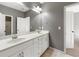 Bright bathroom boasts dual sinks, a large mirror, and ample counter space at 3709 Baxley Ridge Dr, Suwanee, GA 30024