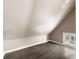 Cozy bedroom features a vaulted ceiling, natural light, and wood floors at 3709 Baxley Ridge Dr, Suwanee, GA 30024