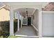 Inviting front porch with white columns and elegant hanging lanterns leads to the black front door at 3709 Baxley Ridge Dr, Suwanee, GA 30024