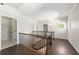 Second floor landing with hardwood floors, laundry closet and natural light at 3709 Baxley Ridge Dr, Suwanee, GA 30024