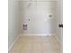 Convenient laundry room with tile flooring ready for appliances at 3709 Baxley Ridge Dr, Suwanee, GA 30024