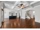 Open floor plan showcases hardwood floors, coffered ceilings, and seamless transitions to the kitchen and staircase at 3709 Baxley Ridge Dr, Suwanee, GA 30024