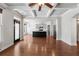 Open living space with hardwood floors, coffered ceiling, and seamless flow to the modern kitchen at 3709 Baxley Ridge Dr, Suwanee, GA 30024