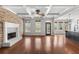 Bright living room with hardwood floors, coffered ceilings, and a brick fireplace creating a cozy and elegant space at 3709 Baxley Ridge Dr, Suwanee, GA 30024