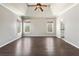 Spacious main bedroom with hardwood floors, a tray ceiling, and three large windows at 3709 Baxley Ridge Dr, Suwanee, GA 30024