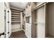 Walk-in closet with custom shelving and drawers for optimized storage solutions at 3709 Baxley Ridge Dr, Suwanee, GA 30024