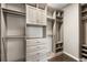 Spacious walk-in closet with custom shelving and drawers for ample storage at 3709 Baxley Ridge Dr, Suwanee, GA 30024