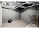 Unfinished basement featuring workout equipment and black rubber flooring at 7665 Golden Sands Dr, Cumming, GA 30041