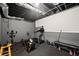 Basement gym area featuring exercise equipment, weights, and rubber flooring at 7665 Golden Sands Dr, Cumming, GA 30041