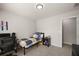 Cozy room with neutral carpet, simple furnishings, and desk setup for work or study at 7665 Golden Sands Dr, Cumming, GA 30041