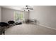 Spacious bedroom with large window, desk area, and comfortable seating, perfect for relaxation at 7665 Golden Sands Dr, Cumming, GA 30041