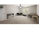 This bedroom has a ceiling fan, neutral-colored walls, two desks, and a window that provides natural light at 7665 Golden Sands Dr, Cumming, GA 30041