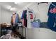Walk-in closet with metal shelving for clothes, shoes, and accessories, maximizing storage at 7665 Golden Sands Dr, Cumming, GA 30041