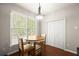 Cozy dining area with wood table, chairs, and natural light at 7665 Golden Sands Dr, Cumming, GA 30041