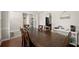 Spacious dining room with a large wooden table, ideal for Gathering gatherings and entertaining at 7665 Golden Sands Dr, Cumming, GA 30041