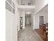 Bright entryway featuring a carpeted floor, white door, and natural light streaming in at 7665 Golden Sands Dr, Cumming, GA 30041