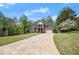 Inviting two-story residence with a spacious driveway and well-maintained landscaping at 7665 Golden Sands Dr, Cumming, GA 30041
