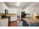 Beautiful kitchen with modern appliances, wooden floor, and granite countertops at 7665 Golden Sands Dr, Cumming, GA 30041