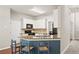 Bright kitchen with granite counters and stainless steel appliances at 7665 Golden Sands Dr, Cumming, GA 30041