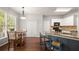 Kitchen and dining area featuring modern appliances and hardwood floors at 7665 Golden Sands Dr, Cumming, GA 30041