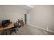 Neutral-toned office featuring plush carpeting, a desk, and an adjacent door at 7665 Golden Sands Dr, Cumming, GA 30041