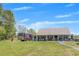 Well-kept backyard with an expansive lawn and covered porch, ideal for outdoor activities at 12 Little Creek Manor Dr, Dallas, GA 30157