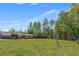 Expansive backyard featuring outbuildings, room to roam and recreational activities at 12 Little Creek Manor Dr, Dallas, GA 30157