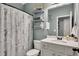 Charming bathroom with shelving, stylish decorations, and a shower with a seahorse shower curtain at 12 Little Creek Manor Dr, Dallas, GA 30157