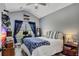 Inviting bedroom with vaulted ceiling, plush bedding, and a well-lit workspace near the window at 12 Little Creek Manor Dr, Dallas, GA 30157