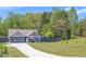 Charming single-Gathering home with a two-car garage and inviting front lawn at 12 Little Creek Manor Dr, Dallas, GA 30157