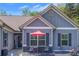Inviting entrance of a well-maintained single-Gathering home with a seating area at 12 Little Creek Manor Dr, Dallas, GA 30157