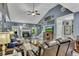 Spacious living area featuring a cozy fireplace, plush seating, and a vaulted ceiling at 12 Little Creek Manor Dr, Dallas, GA 30157