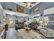 Living room with two sofas, decorative lighting, and open to the kitchen at 12 Little Creek Manor Dr, Dallas, GA 30157