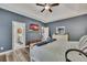 This main bedroom with walk-in closet offers a comfortable space with bright natural light and easy access to the ensuite bath at 12 Little Creek Manor Dr, Dallas, GA 30157