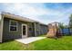 View of backyard with above ground pool, concrete patio, and green siding at 142 Susie Creek Ln, Villa Rica, GA 30180