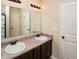 Bathroom featuring a double vanity, and a view of the water closet and shower at 142 Susie Creek Ln, Villa Rica, GA 30180