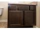 The bathroom vanity features dark cabinets, speckled countertop, and white sink at 142 Susie Creek Ln, Villa Rica, GA 30180