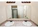 Bathroom featuring a double sink vanity with an expansive mirror at 142 Susie Creek Ln, Villa Rica, GA 30180