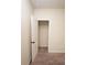 A bedroom closet is shown with an open white door and brown carpet in the bedroom at 142 Susie Creek Ln, Villa Rica, GA 30180