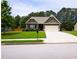 Charming single-story home with a well-maintained lawn, attached garage, and tasteful landscaping at 142 Susie Creek Ln, Villa Rica, GA 30180