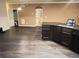 Open-concept kitchen featuring dark wood cabinets, granite countertops, and modern appliances at 142 Susie Creek Ln, Villa Rica, GA 30180