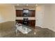 Modern kitchen with granite countertops, stainless sink, and dark wood cabinets at 142 Susie Creek Ln, Villa Rica, GA 30180