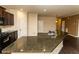 Granite countertops, stainless sink in open-concept kitchen and living room area at 142 Susie Creek Ln, Villa Rica, GA 30180