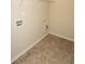 Laundry room featuring tile flooring, wire racks, and connections at 142 Susie Creek Ln, Villa Rica, GA 30180