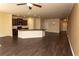 Spacious living room with dark hardwood floors and open-concept kitchen at 142 Susie Creek Ln, Villa Rica, GA 30180