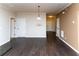 Spacious living area with hardwood floors and a pendant light at 142 Susie Creek Ln, Villa Rica, GA 30180