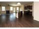 Open concept living area with hardwood floors seamlessly connecting the kitchen and living room at 142 Susie Creek Ln, Villa Rica, GA 30180